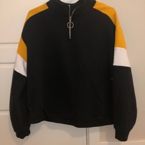 Black, white, and yellow partial zip sweatshirt